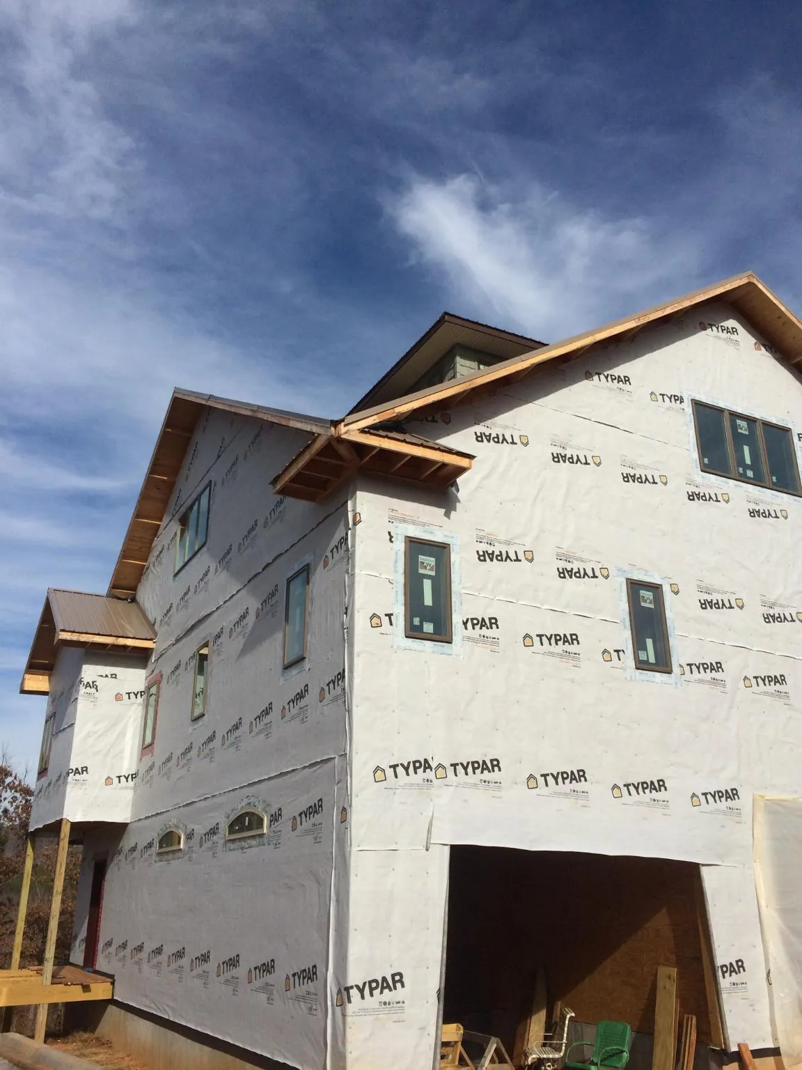 Stick built house wrapped in Typar with new roof framing and dormers in Riverview